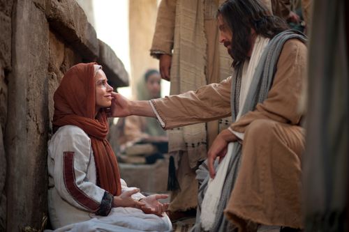 depiction of Jesus and the woman healed of the issue of blood