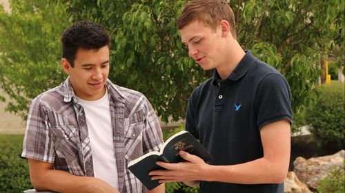 young men sharing scripture