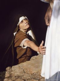 woman touching Christ’s robe