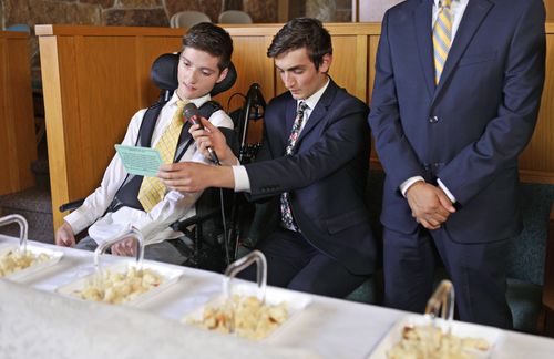 young men blessing sacrament