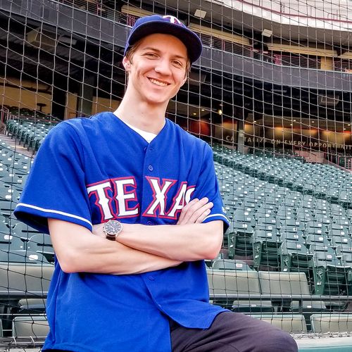 Young man at baseball stadium