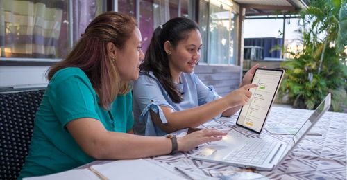 young woman and mother doing family history