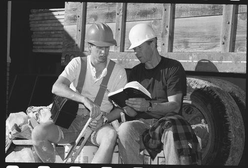 man sharing Book of Mormon