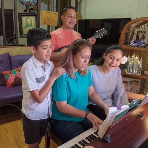 family singing and playing music