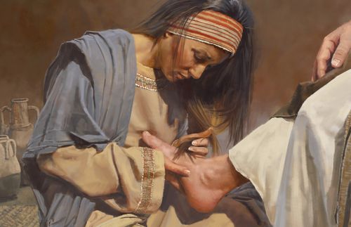 woman washing Jesus’s feet