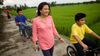 family interacts as they walk outdoors