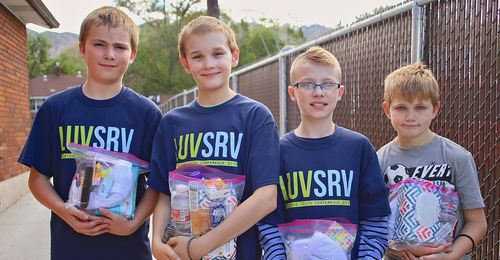 youth with hygiene kits