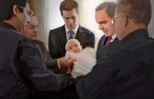 men giving a baby a blessing