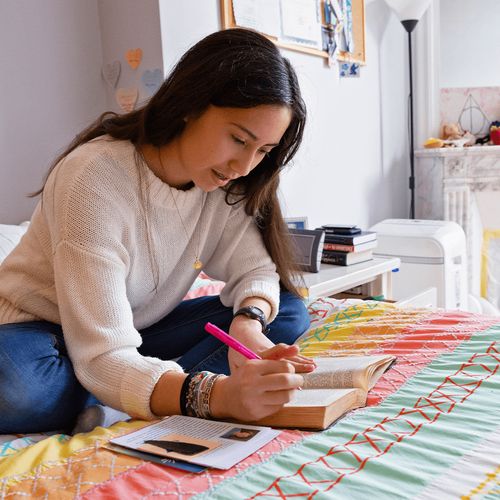 young woman studying scriptures