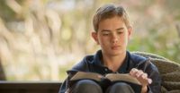 young man reading scriptures