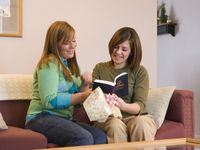 women sharing Book of Mormon