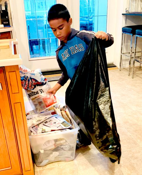 boy helping clean at home