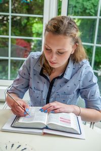 youth studying the Bible