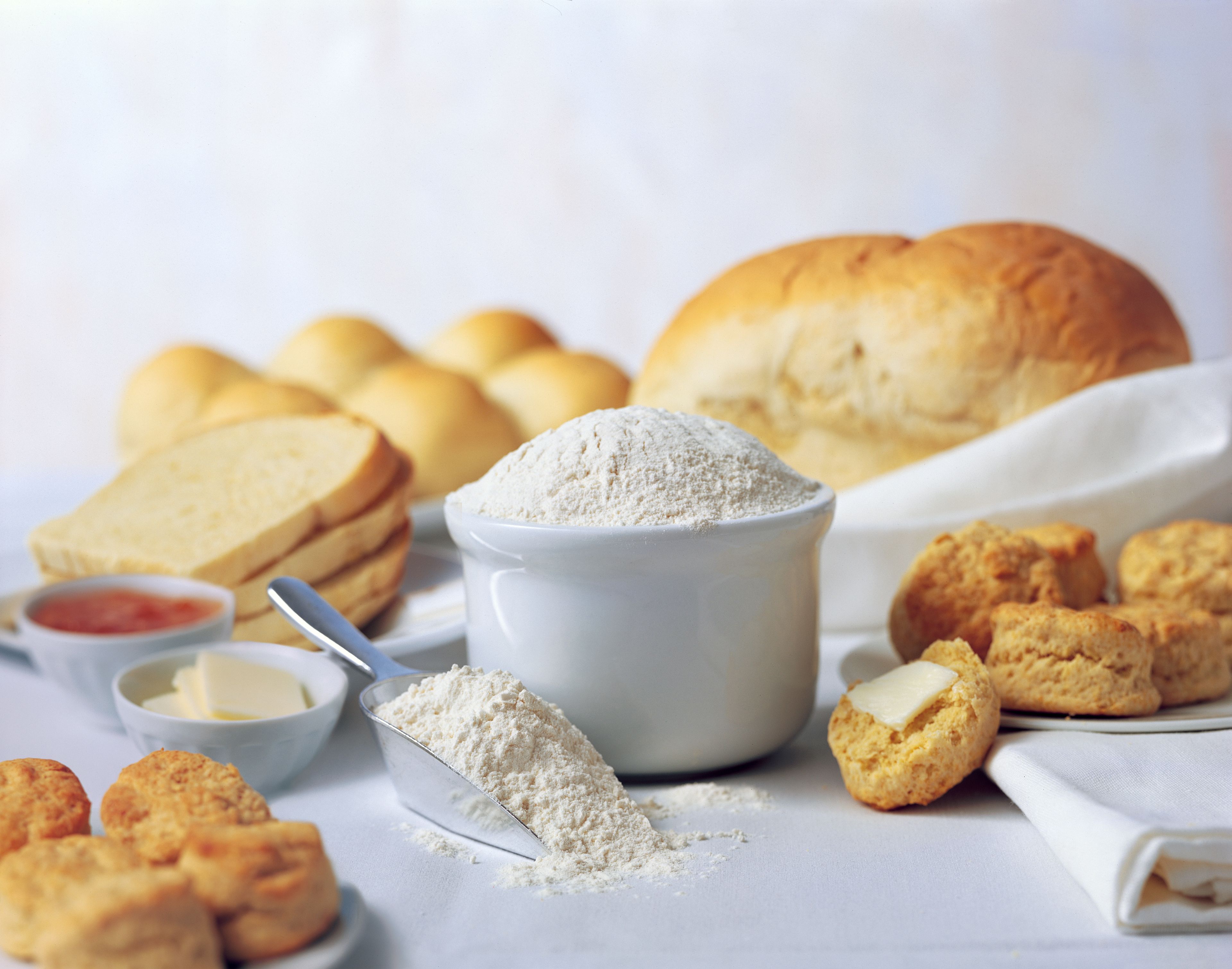 A setting of different kinds of breads and flour.