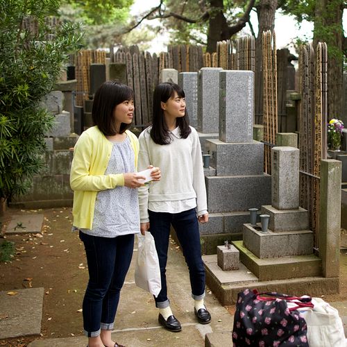 family visiting graves