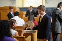 young men administering sacrament