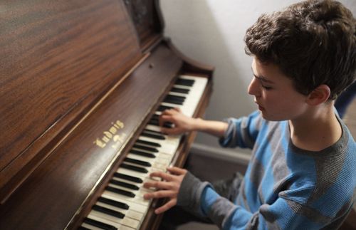 young man playing the piano