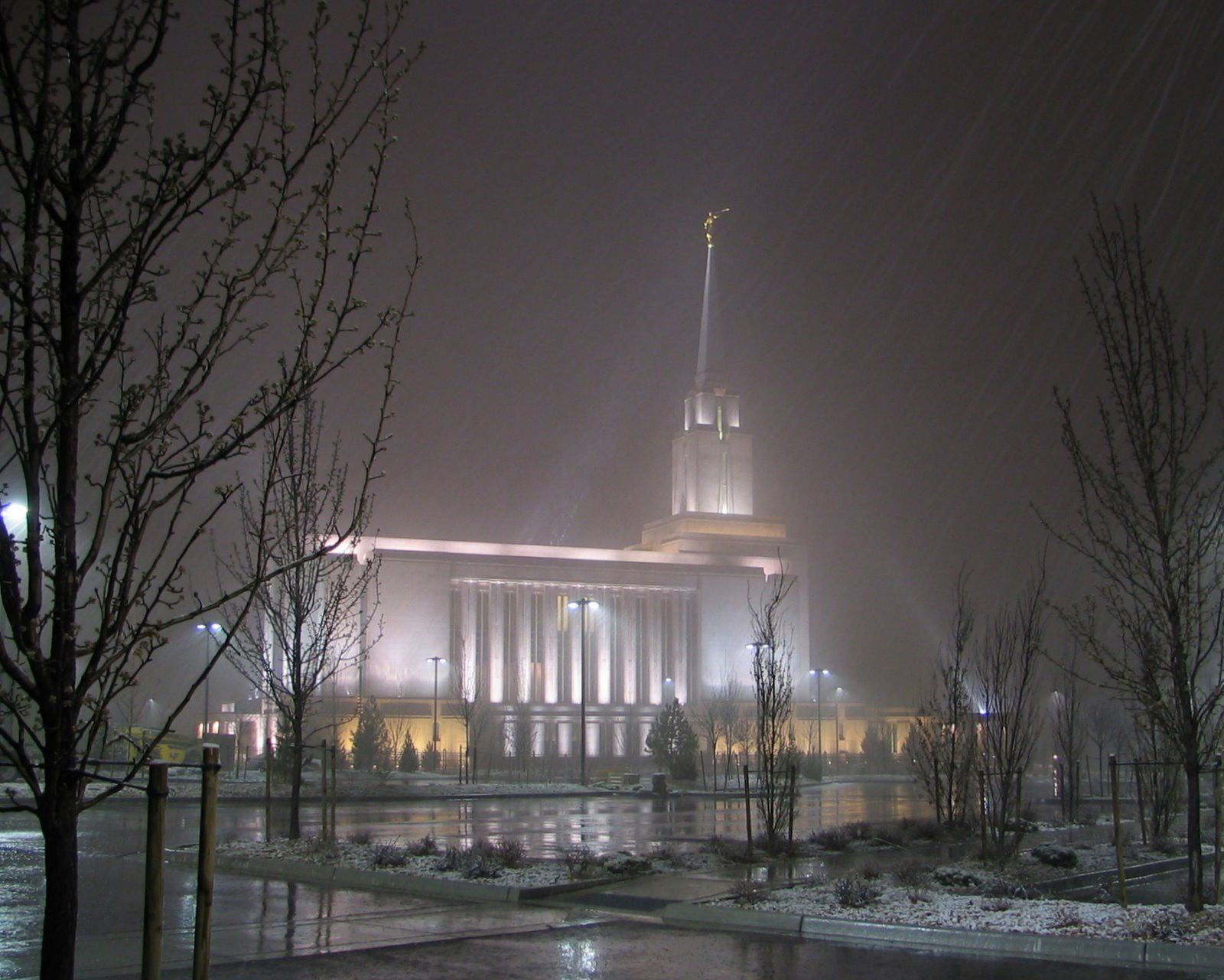 The Oquirrh Mountain Utah Temple in the evening during winter, including scenery.