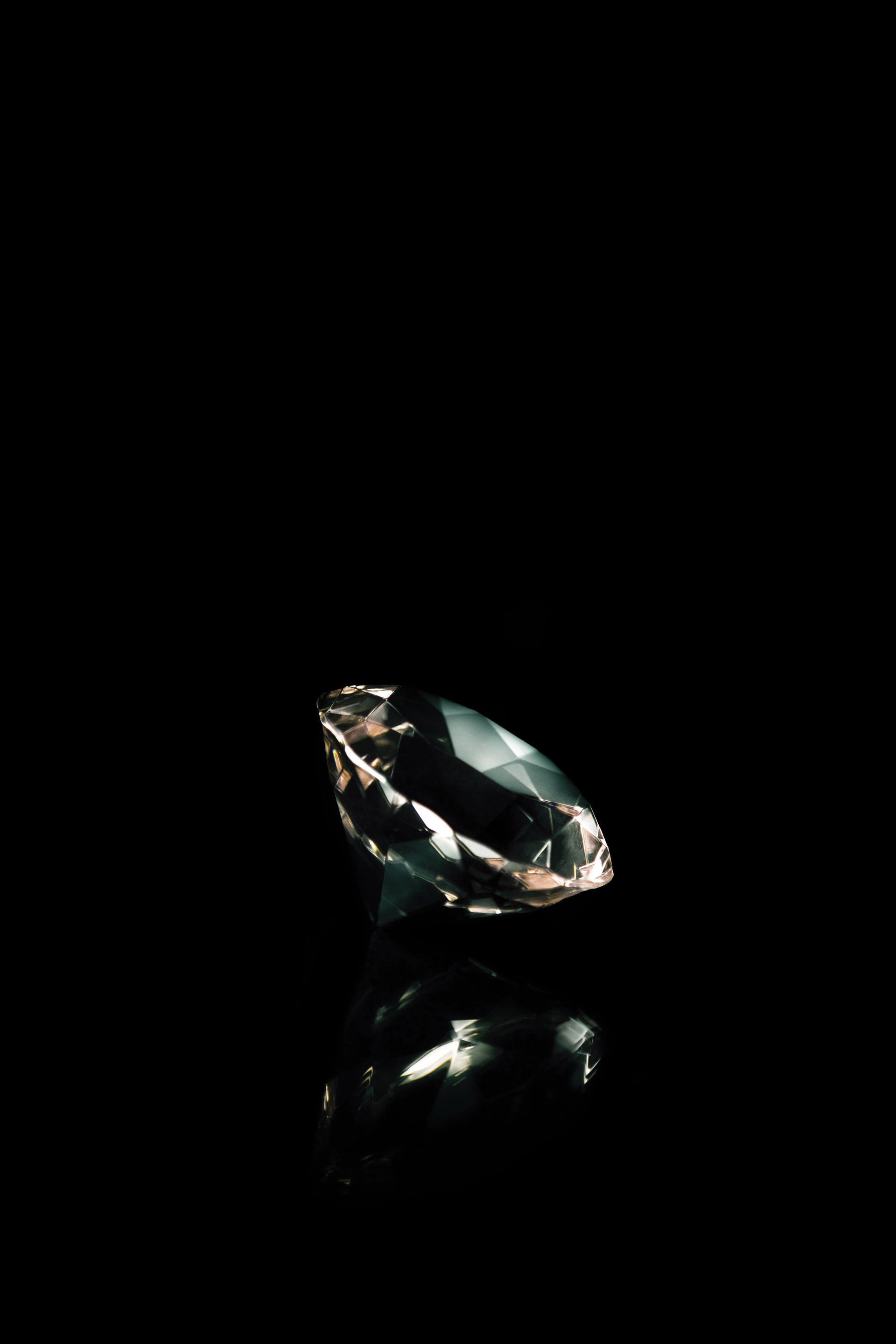 A diamond photographed against a black background.