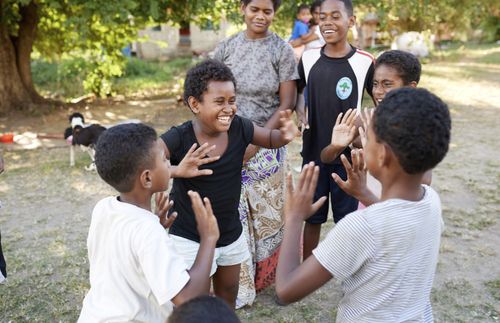 youth playing hand game