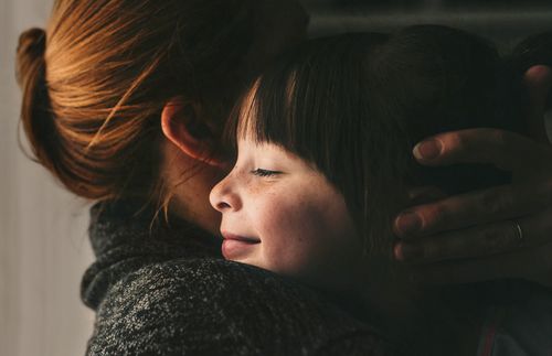 mother and daughter hugging