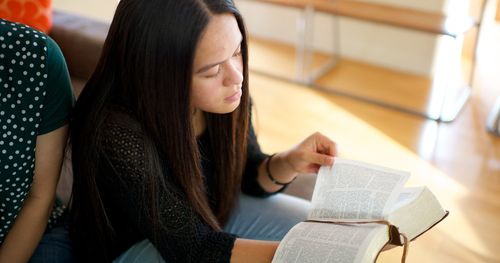 girl reading the scriptures