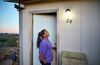 woman looking at outdoor light fixture