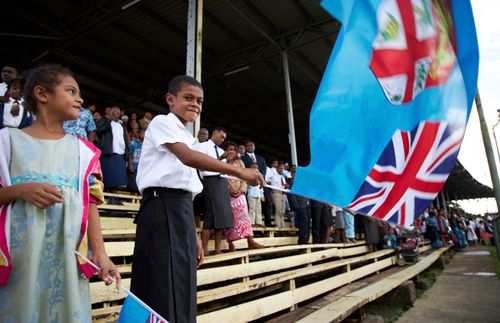 child waving a flag