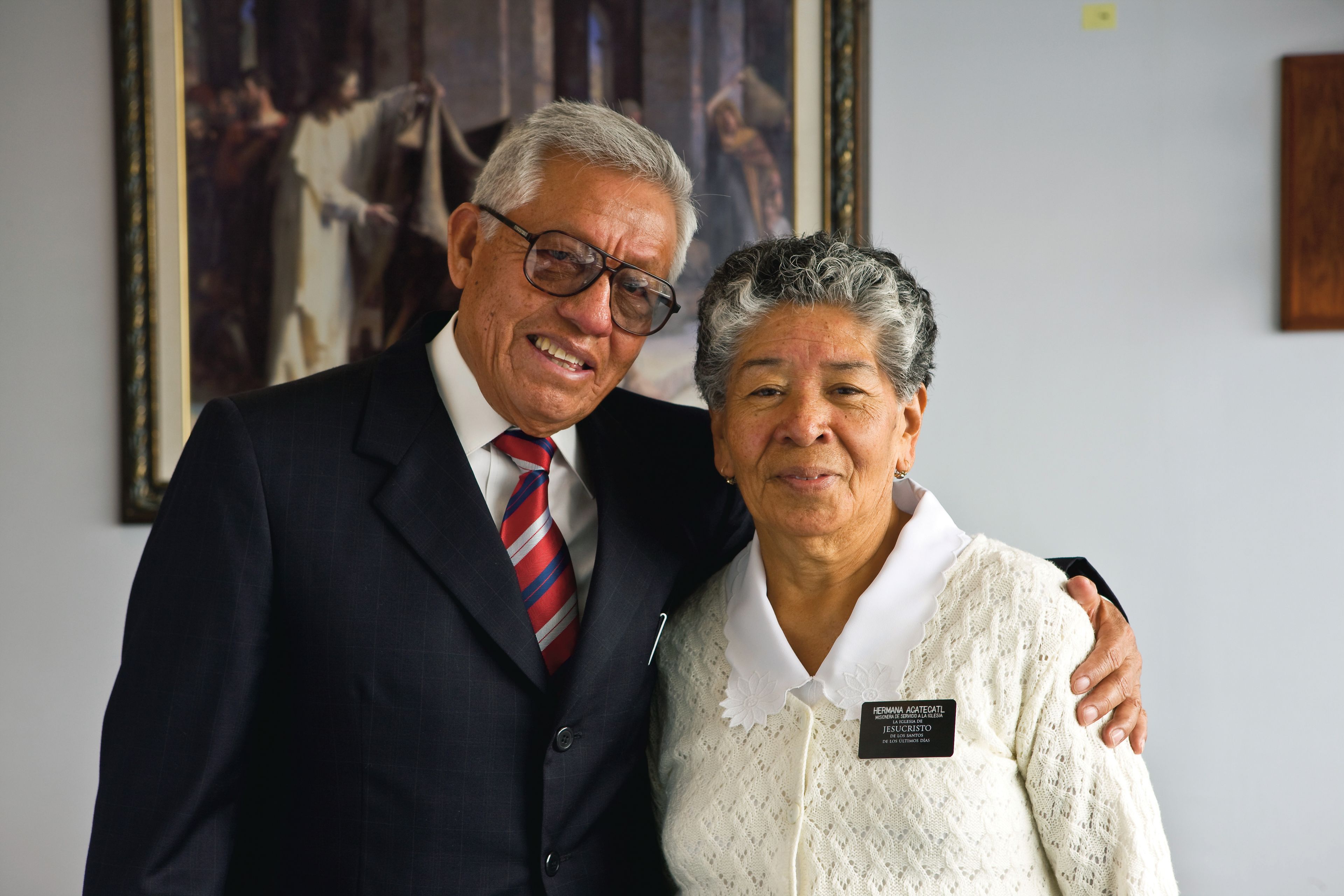 A senior missionary couple standing beside each other in Mexico City.