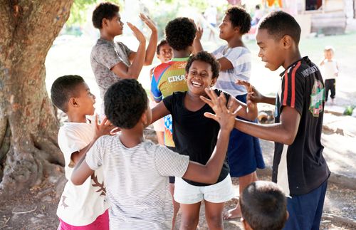 children laughing and playing