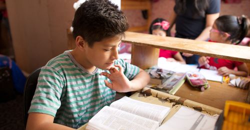 young man studying scriptures