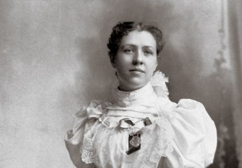 Louie Shurtliff Smith, President Joseph Fielding Smith’s first wife, in a white dress with her hair pulled back.