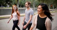 Young adults walking together and talking in Australia