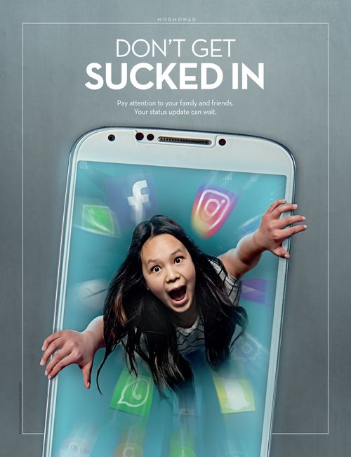 A young woman holding onto the edges of a phone trying not to be sucked in.