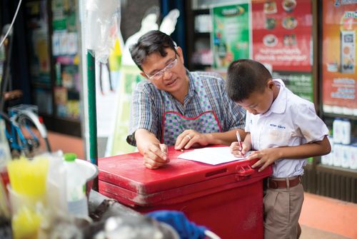 father and son writing