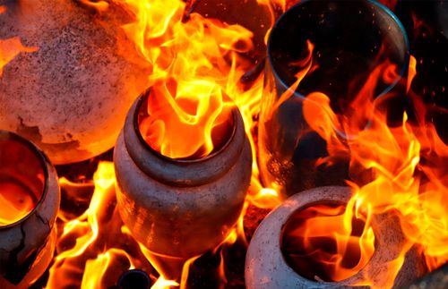 clay vessels on fire