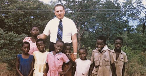 President Monson with children in Africa