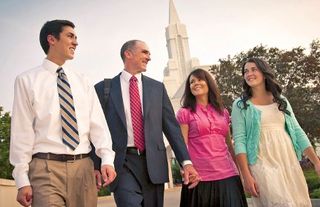 a family walking outside of the temple