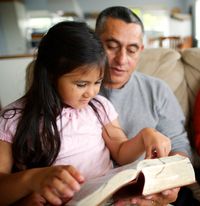 father and daughter reading