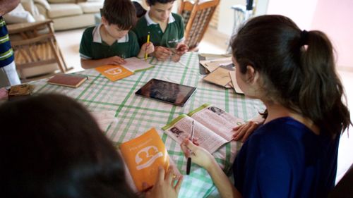 family studying scriptures