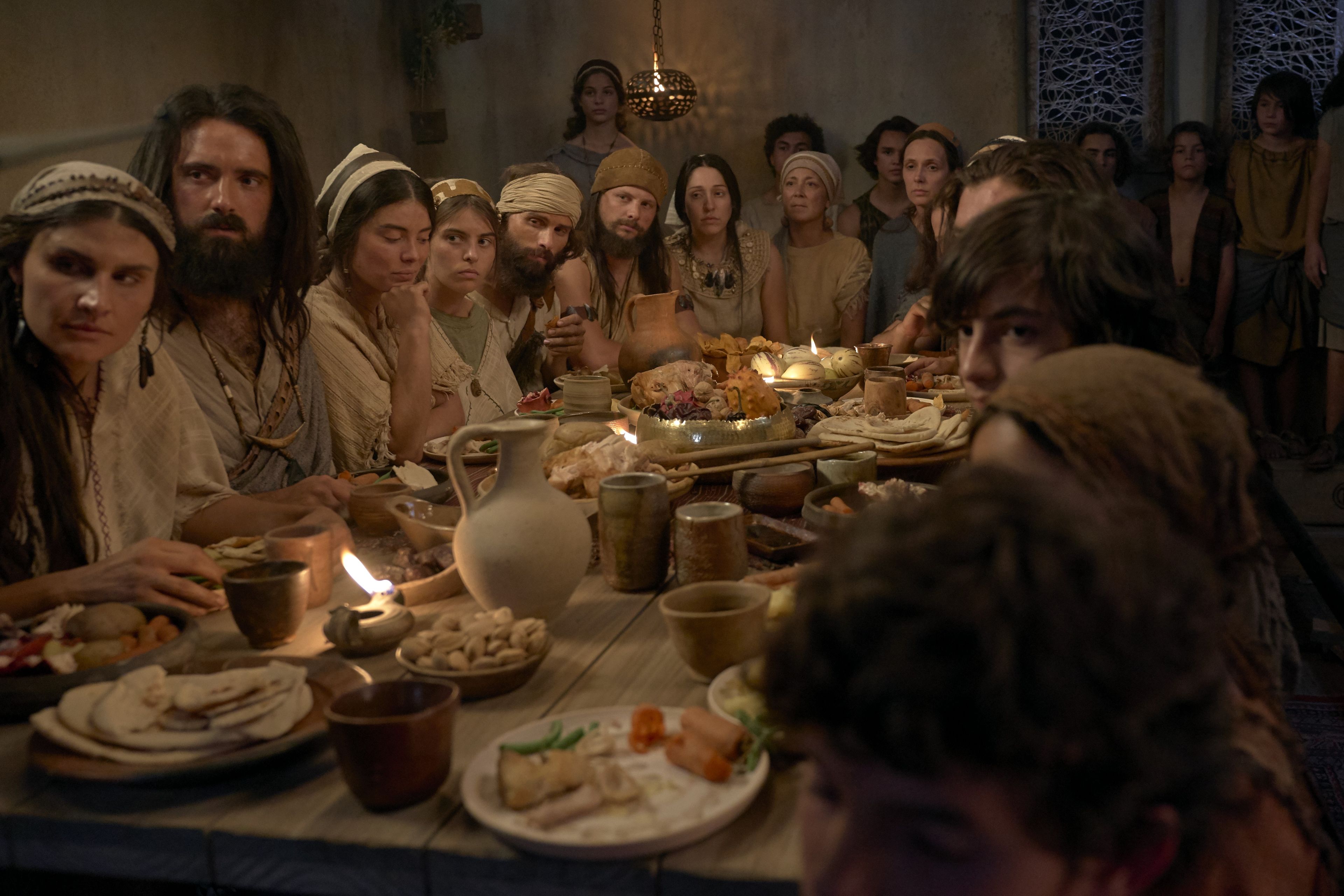 Lehi's family listens to him teach while dining.