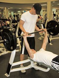 young men lifting weights