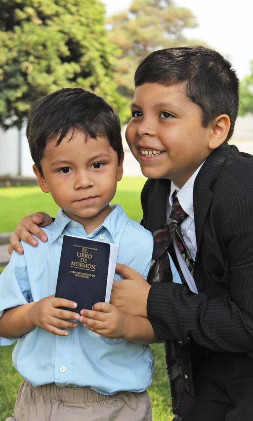 brothers with the Book of Mormon