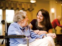 young woman with older woman in wheelchair