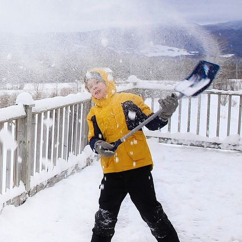 boy shoveling snow