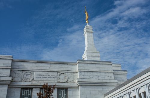 A close-up exterior view of the sign “Holiness to the Lord, The House of the Lord” and the angel Moroni on the Columbia South Carolina Temple.