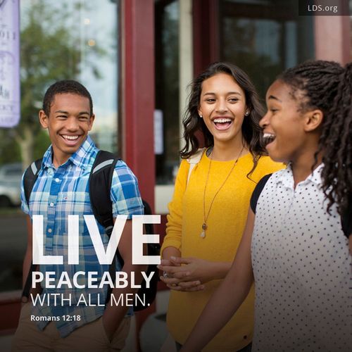 A group of youth laughing, with a quote from Romans 12:18: “Live peaceably with all men.”