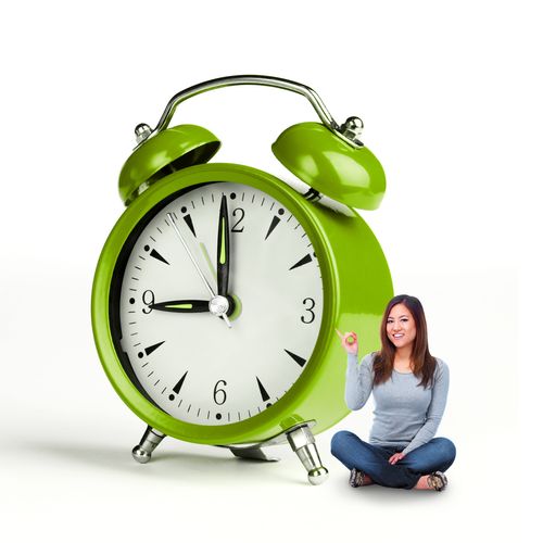 girl and large alarm clock