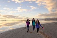 group of youth walking on beach