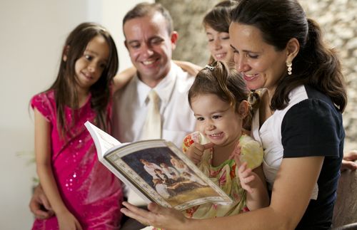 family reading book together